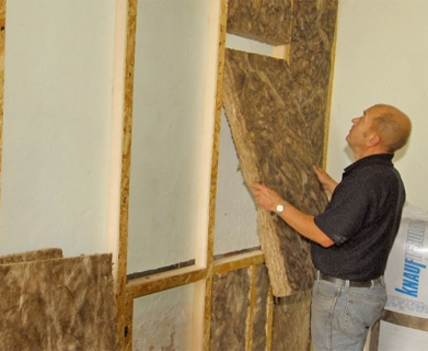 Preparing walls with battens on ready for insulation